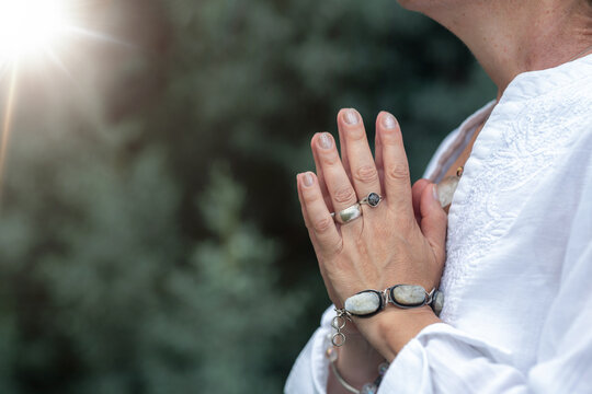 Hands over heart in a heart-centered healing practice, mindfulness meditation