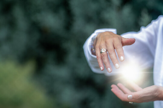 Mindfulness practice balancing healing energy between open hands, spiritual wellness meditation