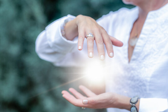 Mindfulness practice with healing light flowing between the hands, spiritual energy meditation