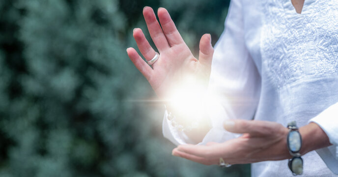 Somatic mindfulness practice balancing healing energy with open hands, spiritual wellness