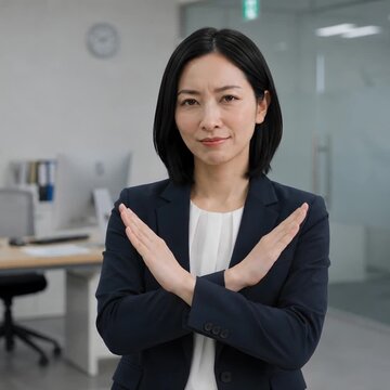 Businesswoman Making a Crossed Arms No Gesture in Office