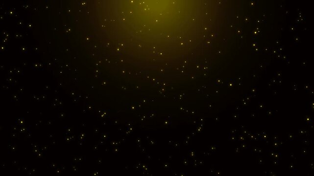 Golden spotlight beam with sparkling dust particles falling on black background loop