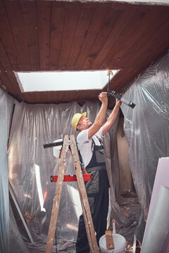 House painter and carpenter working on a home renovation.