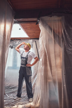 House painter and carpenter working on a home renovation.