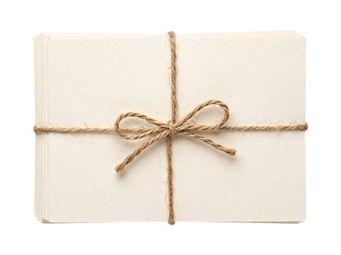 Stack of blank cards tied with twine bow during bright studio lighting Isolated on transparent background