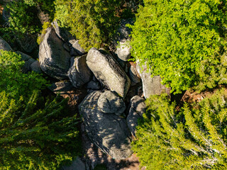 Aerial view of Granodiorite rock formation with visible signs of weathering and erosion known as Markov kamen. Markov Kamen famous rock in between the trees on the Kopaonik mountain in Serbia © nedomacki