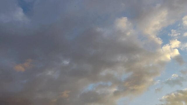 Stratocumulus clouds moving in the sky at twilight
