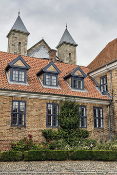 Viborg, Denmark - 07 August 2026: View of historic brick buildings and red tile roofs at Viborg Stift, featuring Danish masonry, dormer windows, and cathedral towers.