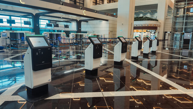 Bhogapuram, Andhra Pradesh, India - 22 August 2026: View of self-service check-in kiosks in the modern terminal of Alluri Sitarama Raju International Airport with polished floors.