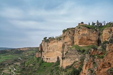 Fototapeta premium The incredible view of the high cliffs of Ronda town, located in Andalucia, southern Spain