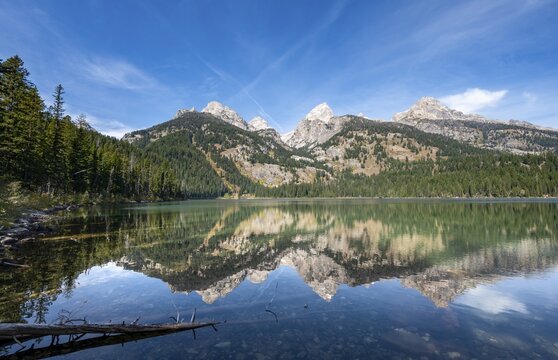 Reflection in Taggart Lake, view of the Teton Range, peaks Grand Teton and Teewinot Mountain, autumn, Grand Teton National Park, Wyoming, USA