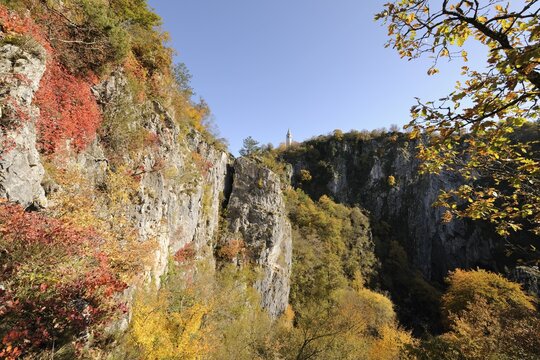 Village rises above the Doline, sinkhole, Velika dolina, aekocjan, Slovenia, Europe