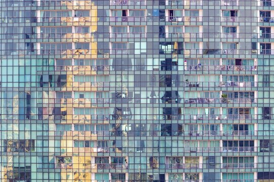 The distinctive fa&ccedil;ade of The River Condominium in Khlong San features a rhythmic pattern of glass, balconies and reflections. The vertical structure accentuates the height of the iconic Riverside skyscraper while capturing Bangkok's urban character, luxury residential projects on the Chao Phraya shore in Khlong Ton Sai, Khlong San, Bangkok, Thailand