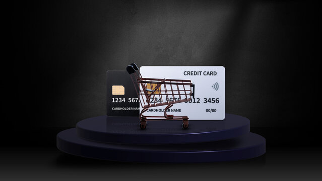 A miniature shopping cart placed in front of two credit cards on a dark podium, symbolizing online shopping, e-commerce, and financial transactions. Concept of Cyber Monday Sale