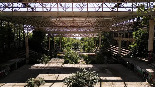 Abandoned unfinished building or warehouse complex with steel roof frame