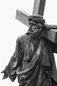 Jesus Christ carrying the cross while wearing a crown of thorns, dramatic Christian sculpture symbolizing sacrifice, suffering, faith and redemption.