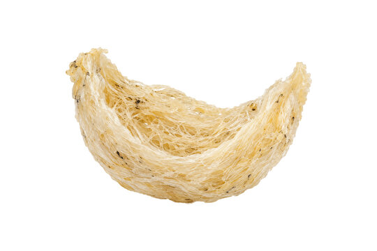 Natural dried edible swiftlet bird&rsquo;s nest with delicate ivory and golden fibrous strands isolated on a pure white background, traditional Asian delicacy and premium culinary ingredient.