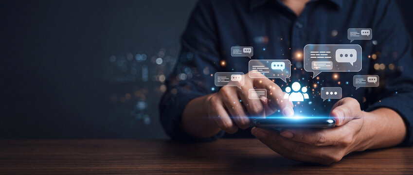 Close-up of person hands using a mobile smartphone with digital chat icons and social media notification bubbles overlay, representing online communication, networking, and digital messaging concept.