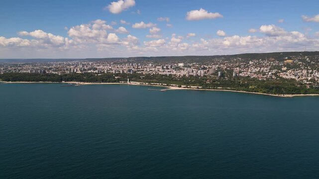 Panoramic aerial view of coastal city Varna with sea, park and blue sky