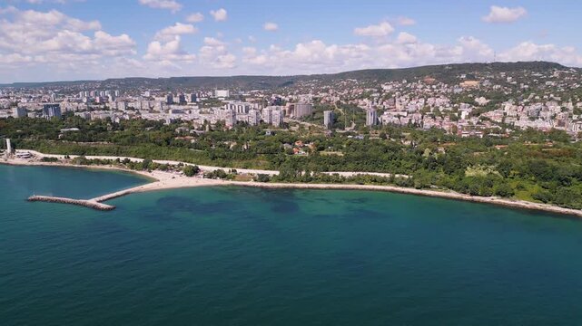 Panoramic aerial view of coastal city Varna with sea, park and blue sky