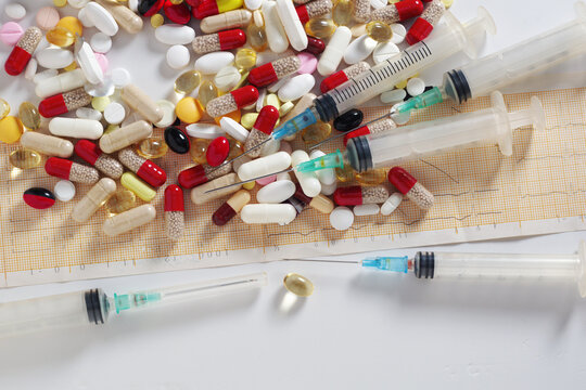 Assorted Pills Capsules and Syringes