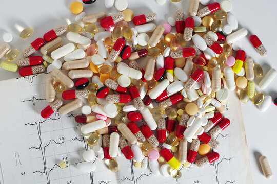 Assorted Pills and Electrocardiogram Chart