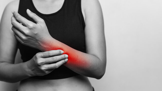 Woman with Forearm and Elbow Pain, Red Highlighted Area Showing Arm Joint Inflammation, Muscle Strain and Healthcare Concept