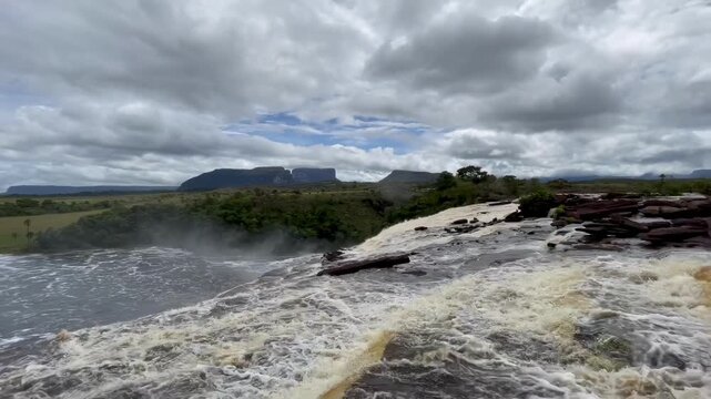 4K Static Shot of Powerful Waterfall in Canaima National Park, Venezuela, with Tepui Mountains Background