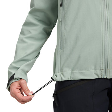 Woman wearing light green jacket pulling hem cord isolated on transparent background