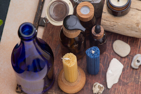 Aromatherapy Still Life with bees wax Candles and Bottles.