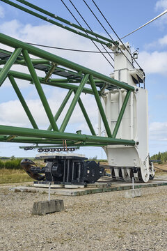 Thisted, Denmark - 11 August 2026: View of the BMS Heavy Cranes 3000 ton electric ring crane at Det Nationale Testcenter for store vindmoller i Osterild, with green steel lattice boom and white base.