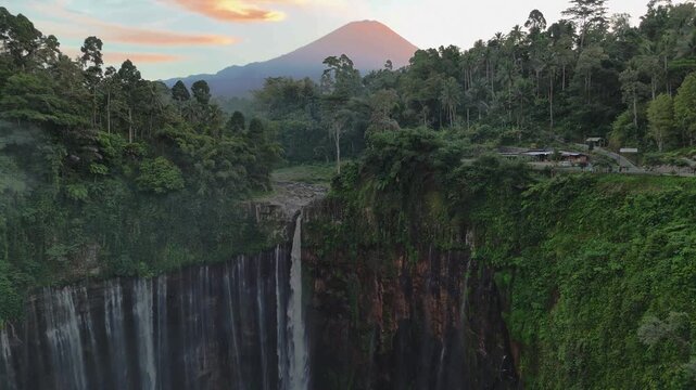 Aerial view of Mt.Semeru with Tumpak Sewu waterfall is one of the most stunning waterfalls in Indonesia, standing at 120 meters tall with the most insane panorama view.