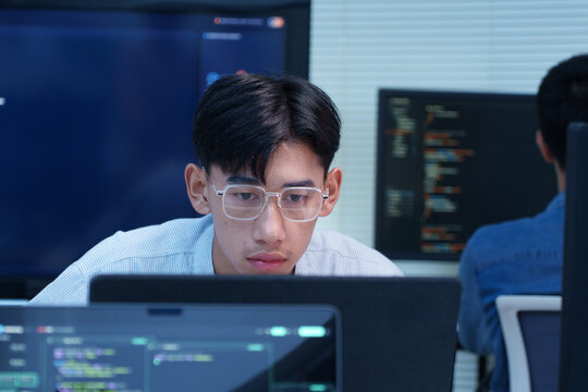 Focused Programmer Coding on a Computer