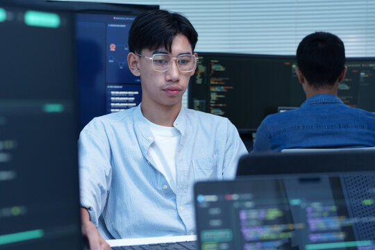Young Programmer Working on Digital Code