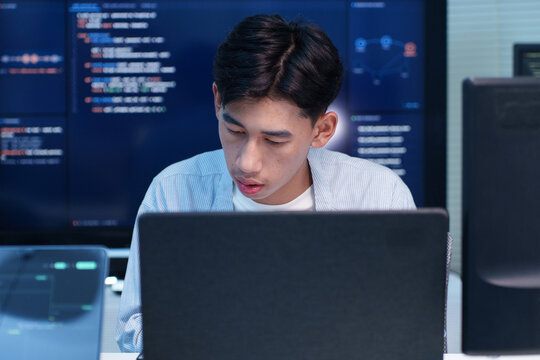 Focused Programmer Working on Digital Code