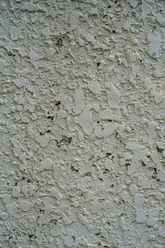 Peeling paint on an old wall showing texture and wear