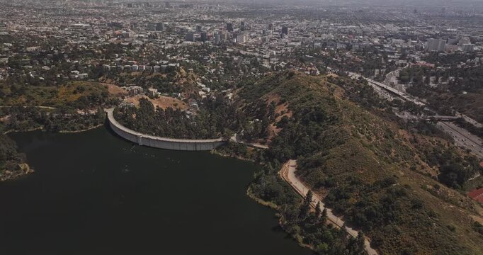 Los Angeles California Aerial v278 birds eye view flyover reservoir capturing dam, residential neighborhoods and downtown cityscape - Shot with 5k Camera - May 26th 2024