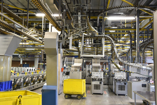 modern machines for transportation in a large print shop for production of newspapers & magazines