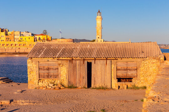 Chania Lighthouse at Sunrise in Old Venetian Harbor, Crete, Greece