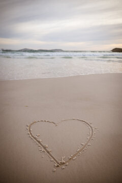 Heart symbol drawn in the fine sand at Squeaky Beach, Wilsons Promontory at sunset
