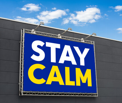 Stay Calm written on a billboard