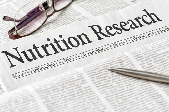 A newspaper with the headline Nutrition Research