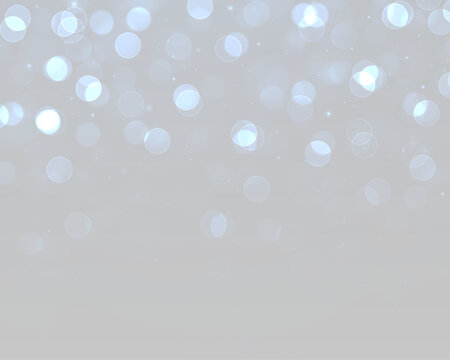 Festive light blur with shimmering bokeh particles and bright highlights.