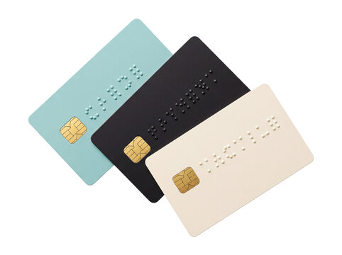 Braille credit card accessibility mockup for visually impaired financial inclusion, showing three minimalist debit plastic cards with EMV chip and raised tactile dots on black background context.