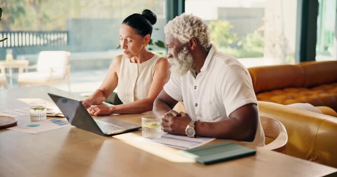 Mature, happy couple and laptop with discussion for budget, pension plan and finance paperwork. Interracial people, track online expenses and monitor annuity account for asset management at home