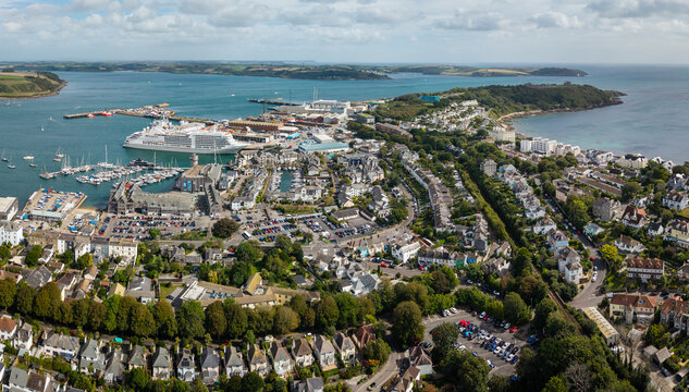 Aerial panorama of Falmouth townscape and docks in Cornwall, UK with cruise ship