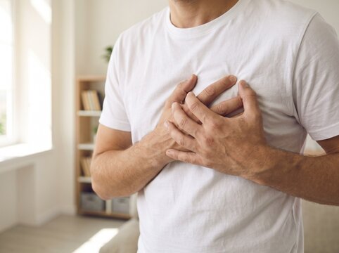 Concept of  chest pain touching chest symbolizing costochondritis symptoms or heart health issues