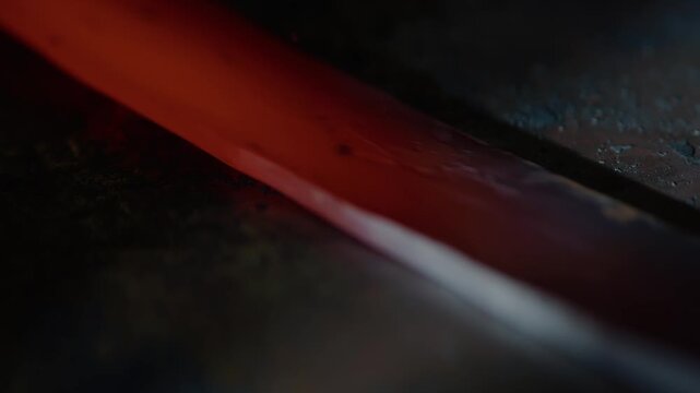 Glowing Hot Metal Bar During Traditional Blacksmith Forging