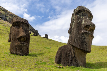 Moai Tukuturi at Rano Rarakuon easter island. Beautiful Moai Statues with beautiful blue sky in the background and green gras in the foreground  © Sven Taubert