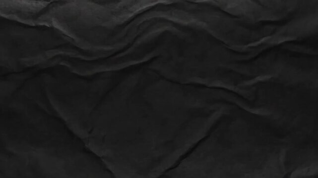 Dark crumpled paper texture moving background loop